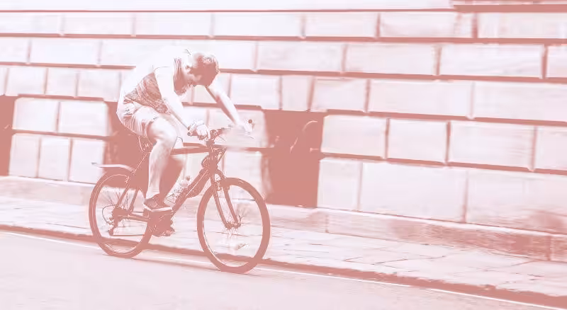 Man putting in a lot of effort to cycle.