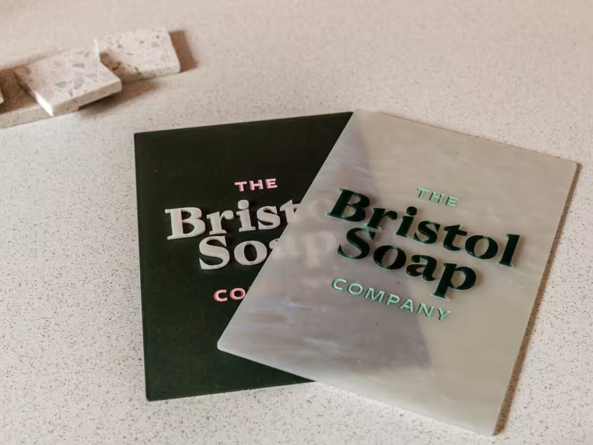 Two cute signs with logos on a desk