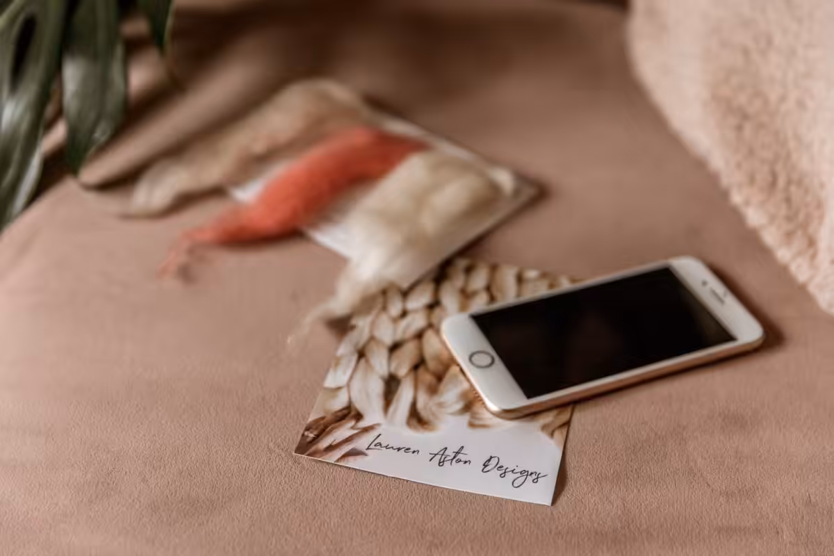 Tools of Instagram influencers - a phone and business card.