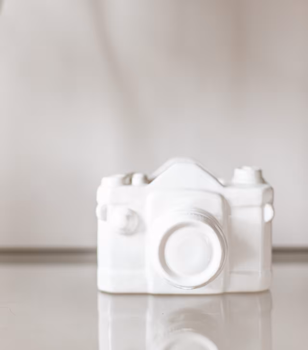 A white block object in the shape of a camera. Its just like a camera but not really!