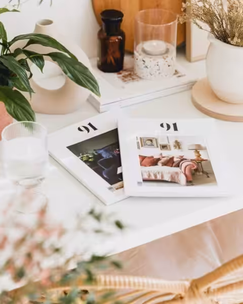 91 Magazine on a desk with plants and candles captured by Georgia de Lotz