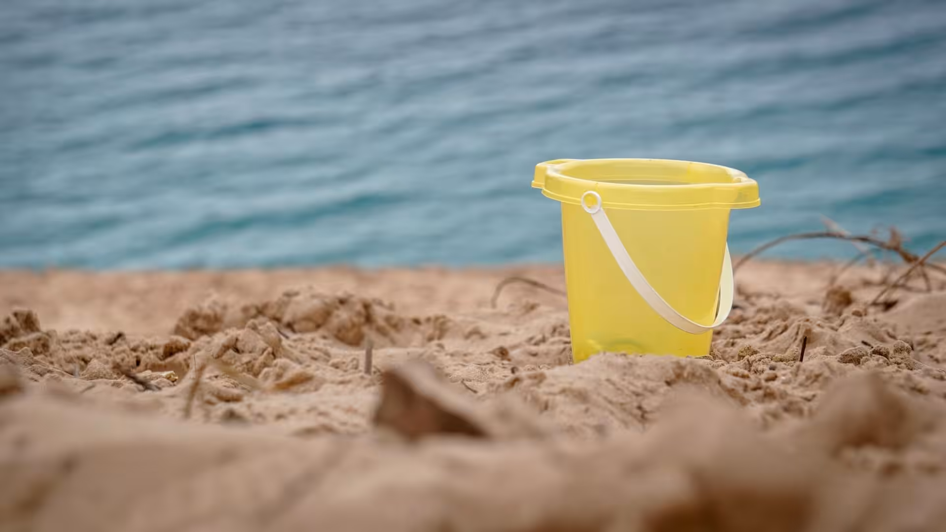  A lonely bucket on the beach.