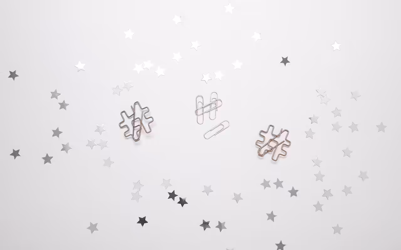 Decorative paperclips interlinked on a table.