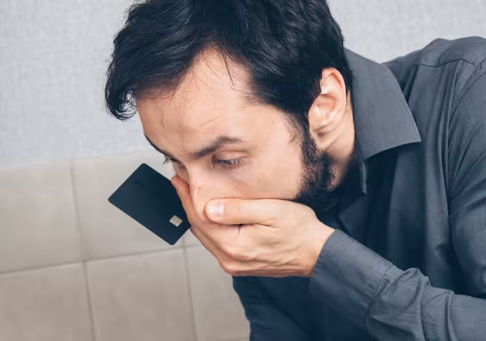 A stock photo of a man who has been scammed proper hamming it up for the camera