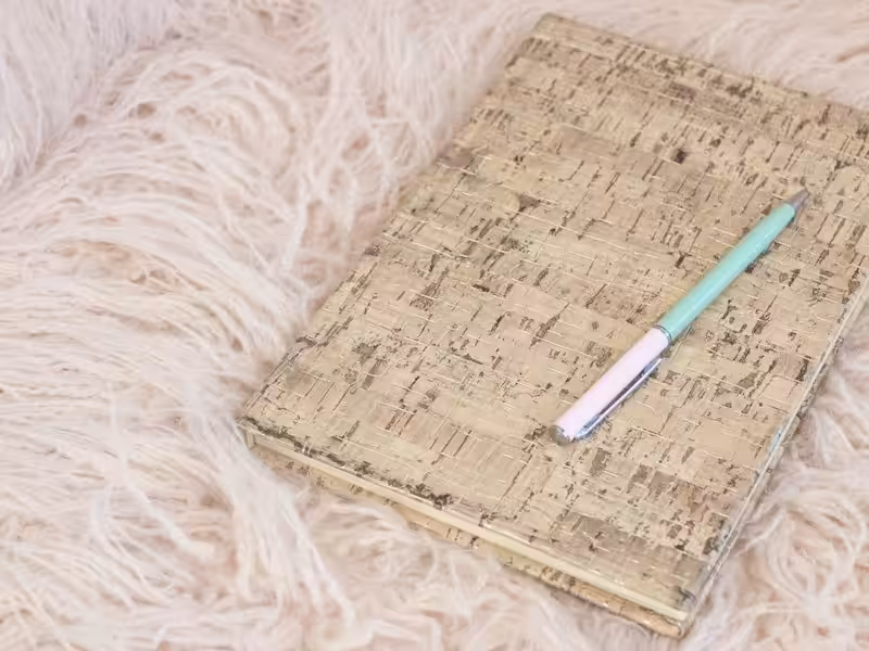 Pen resting on a notepad