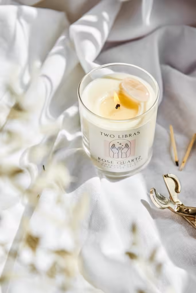 A Two Libras Rose Quartz Candle 