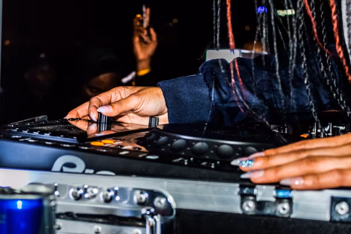 A DJ using equiptment.