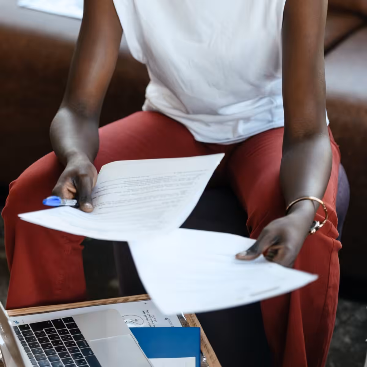 A person reading a manuscript.