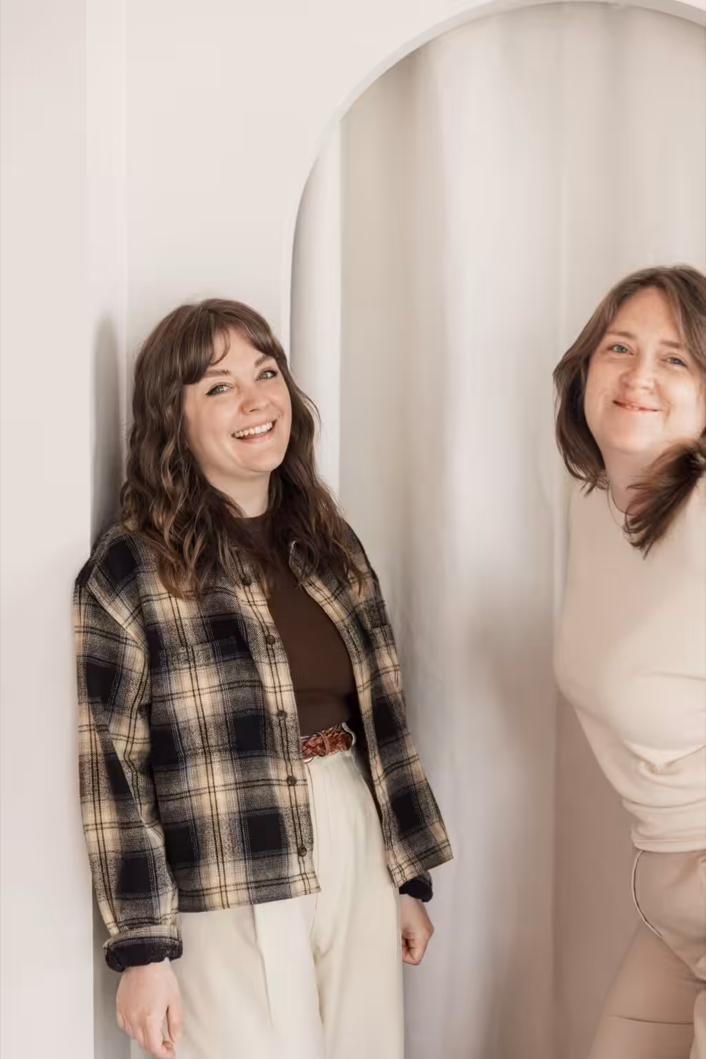 Lyzi and Aime from Studio Cotton smiling at the camera.