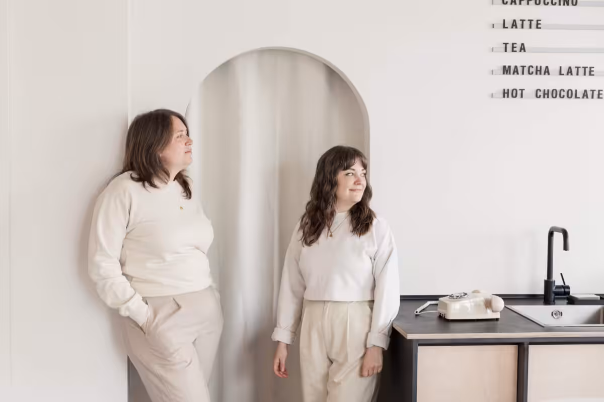 Aime and Lyzi from Studio Cotton standing together at Greytone Coffee in Bristol.