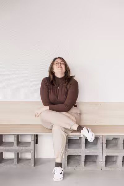 Studio Cotton founder Aime sat looking eager and pleased.