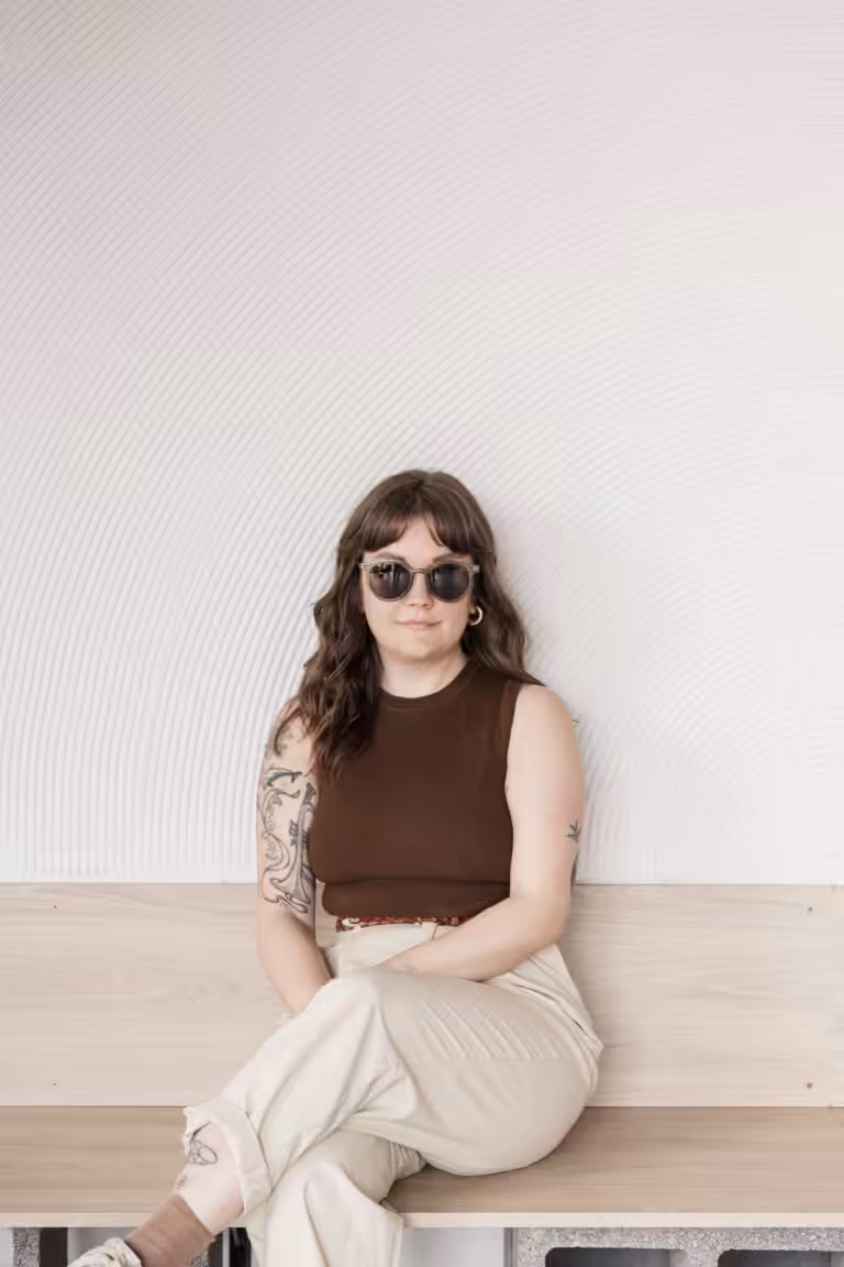 Studio Cotton's content producer Lyzi wearing sunglasses.