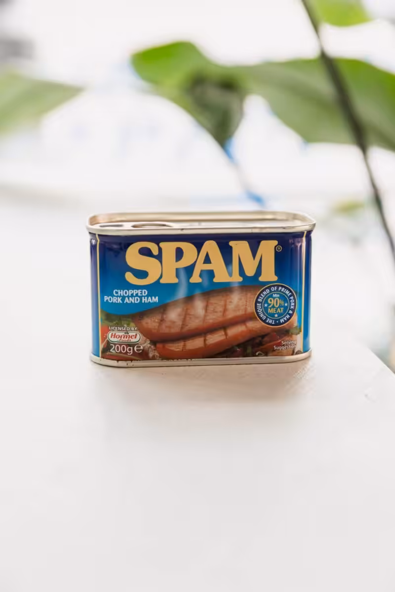 A tin of Spam placed on a worktop.