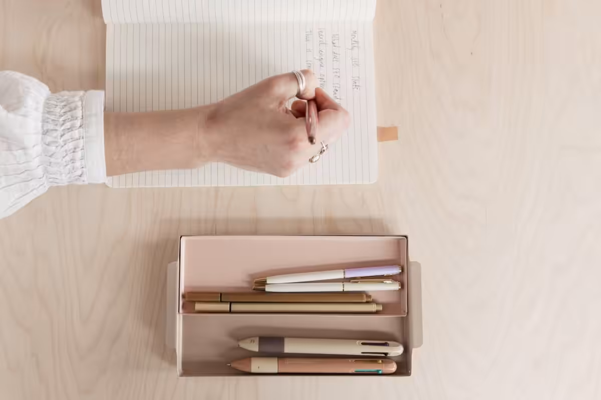 A hand writing notes about Studio Cotton's style.