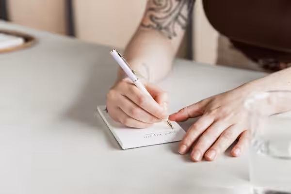 Writing a to-do list at Studio Cotton.