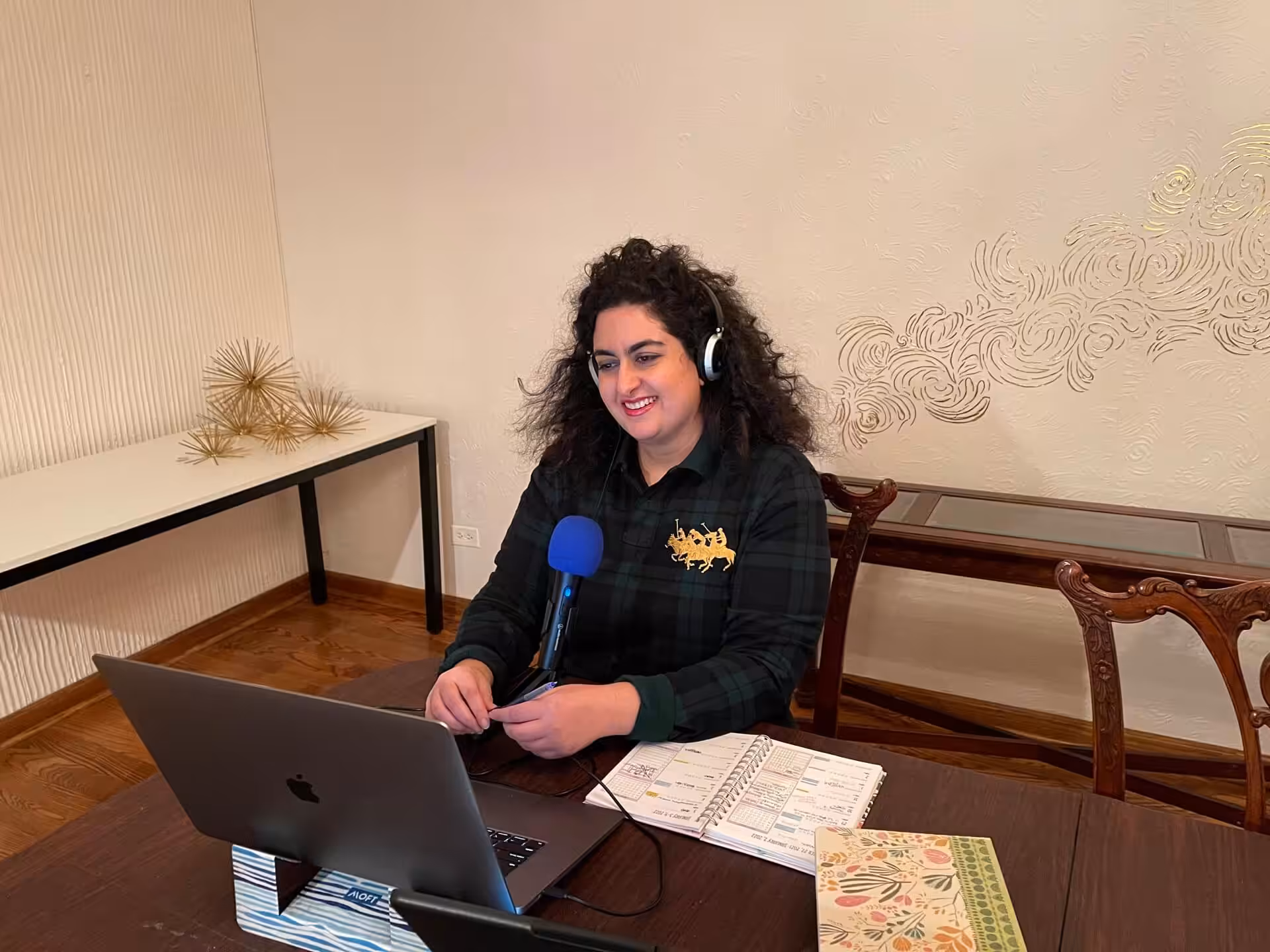 Tara Jabbari recording for a podcast.