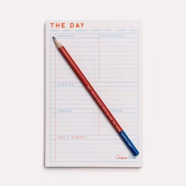 The Day notepad with blue and red ink on white, with sections for morning, afternoon, and evening, as well as urgent, tomorrow, and don't forget sections