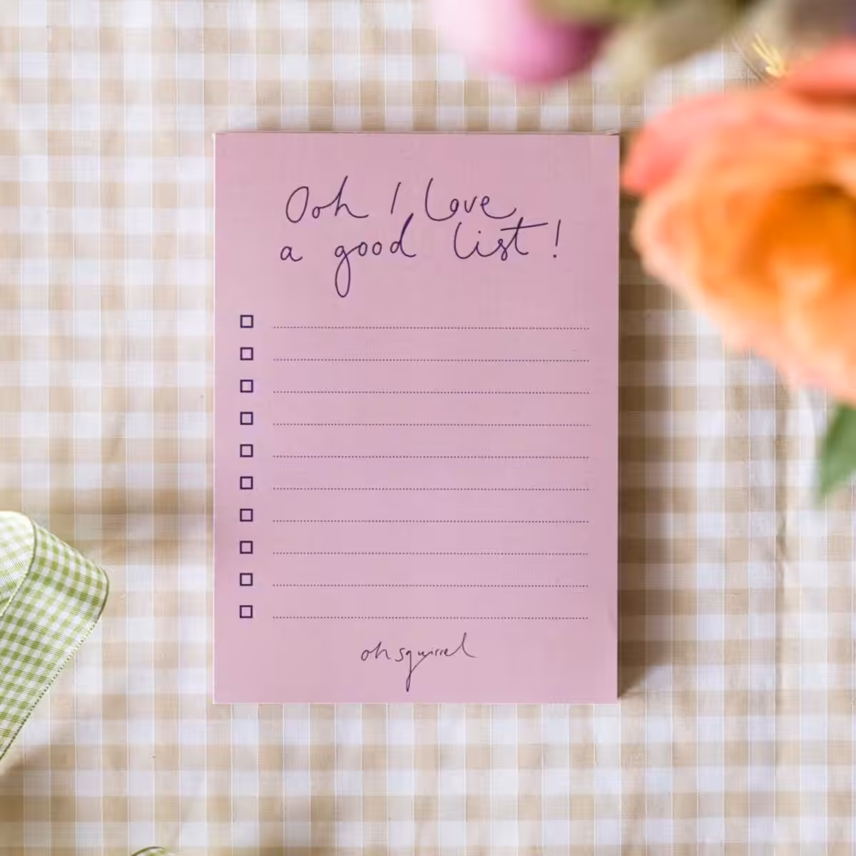 Lilac-pink notepad with "Ooh, I love a good list!" in the signature Oh Squirrel handwriting at the top