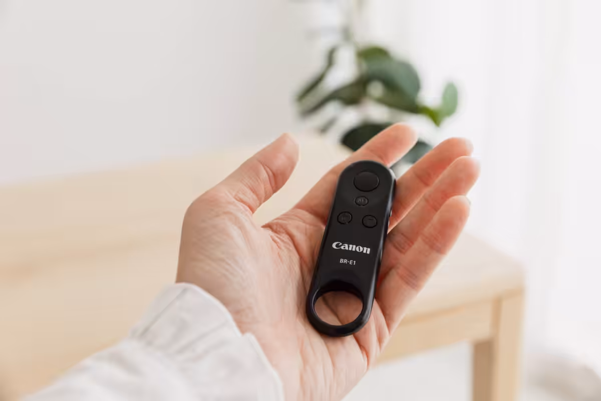 A trusty camera remote in hand.