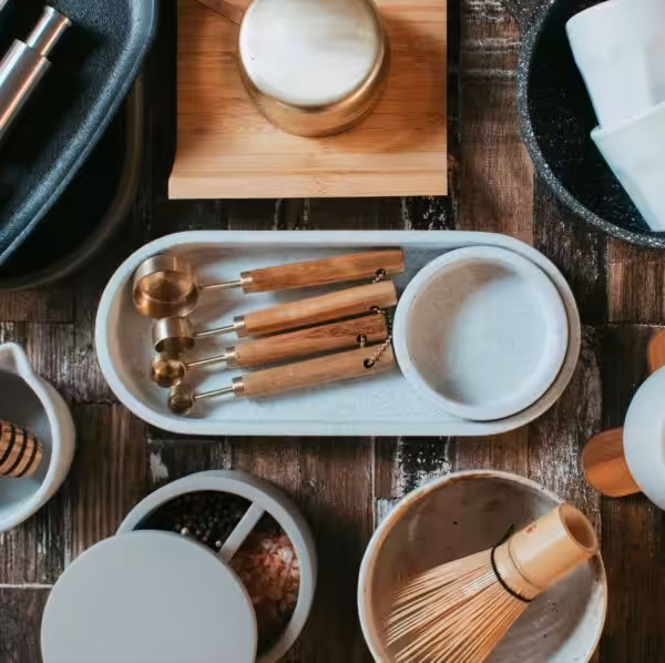 A neat flat lay of various cooking utensils and bowls