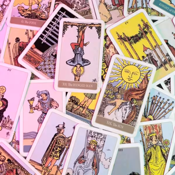 A messy pile of tarot cards
